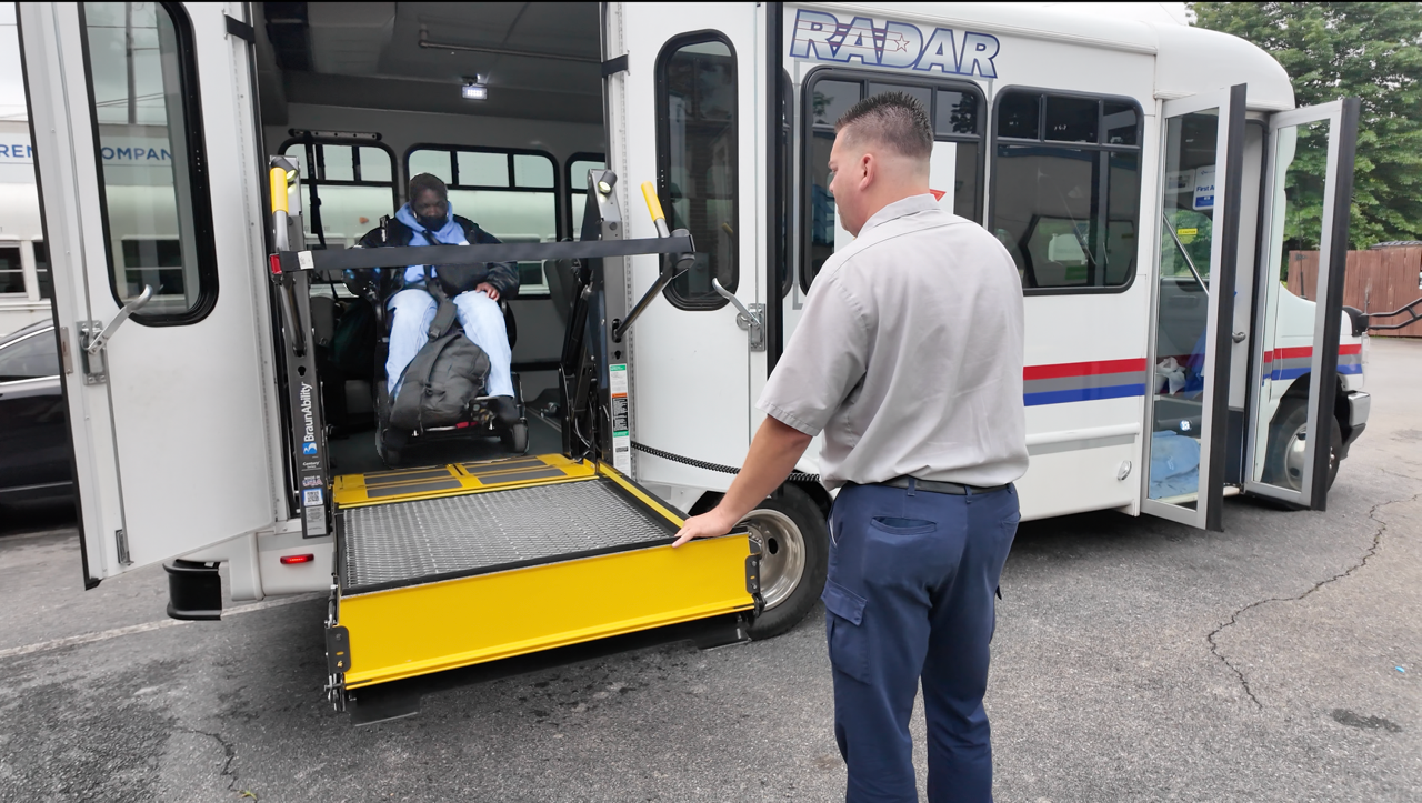 woman using wheelchair elevator on a radar transit bus